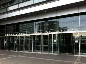 "Front of Bronx County Hall of Justice on 30 June 2012" by Photographer Christopher Le, edited by Blurpeace - Own work. Licensed under CC BY-SA 3.0 via Wikimedia Commons.